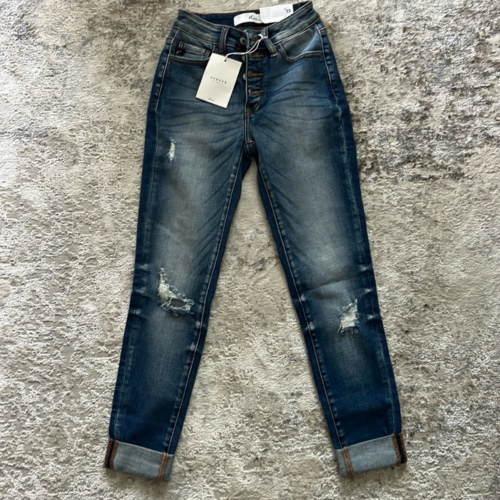 Women’s KanCan Jeans. New with tags, size 0/23, button fly mildly distressed